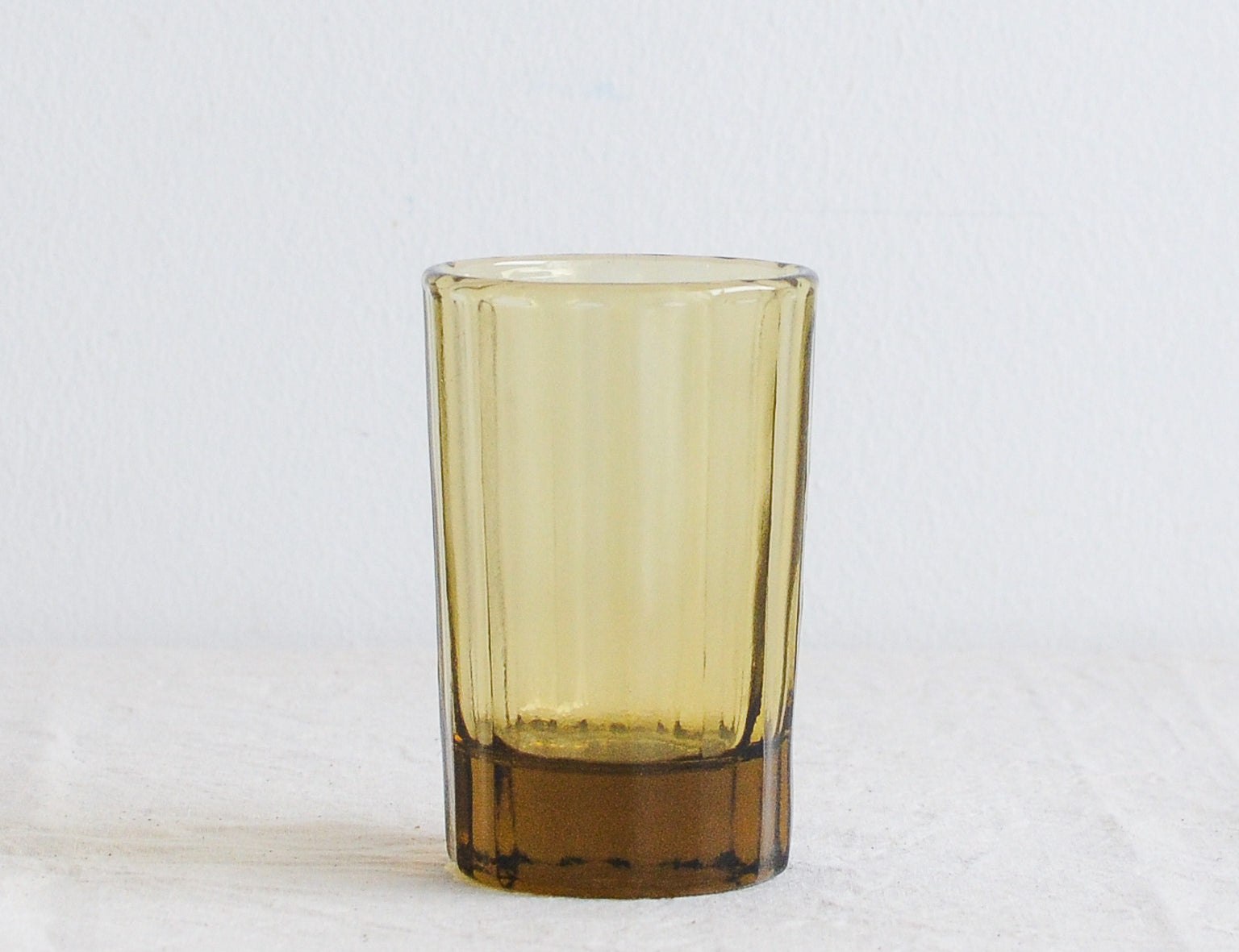 Brut Homeware Reed Water Glass in Amber, made from recycled glass