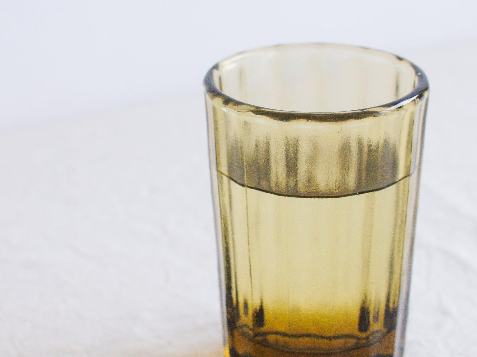 Brut Homeware Reed Water Glass in Amber, made from recycled glass