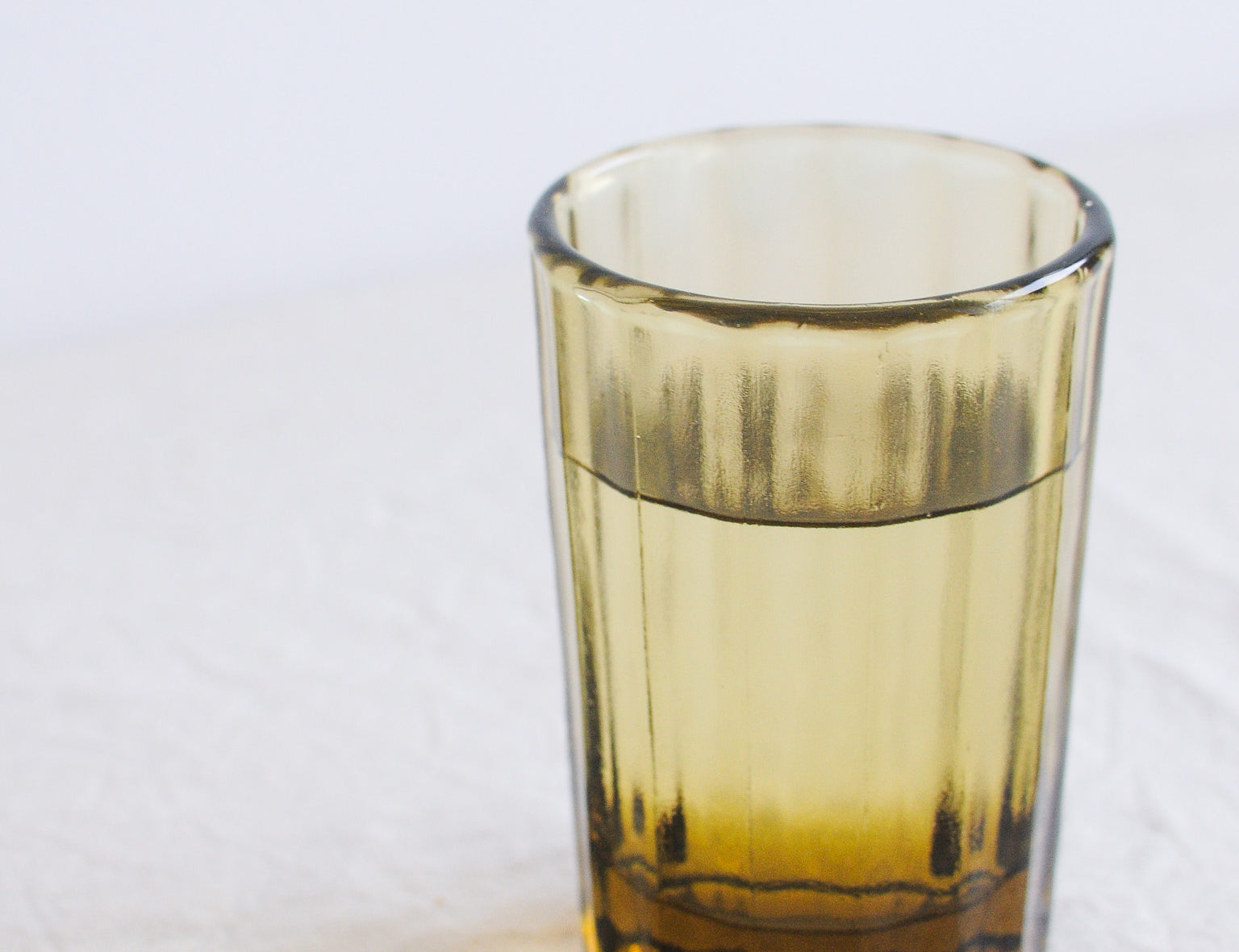 Brut Homeware Reed Water Glass in Amber, made from recycled glass